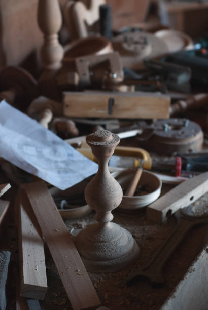 istock untidy workplace in an old carpenter workshop with wood carpenter tools in the background, scattered vintage tools in a rural workshop, 1130845578
