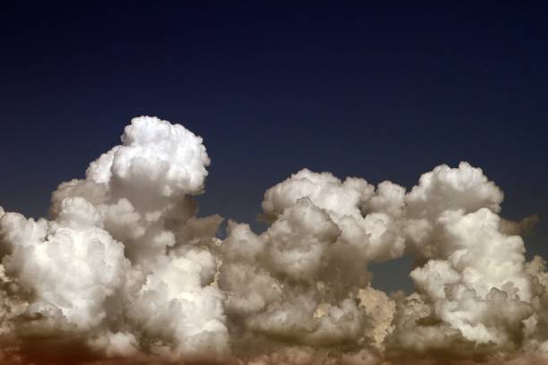 istock lovely bright cumulus clouds in the sky for using in design as background. 1130846766