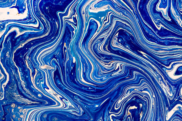 istock Hand painted background with mixed liquid blue, white, yellow paints. Abstract fluid acrylic painting. Applicable for packaging, invitation, textile, wallpaper, design of different surfaces 1130847435