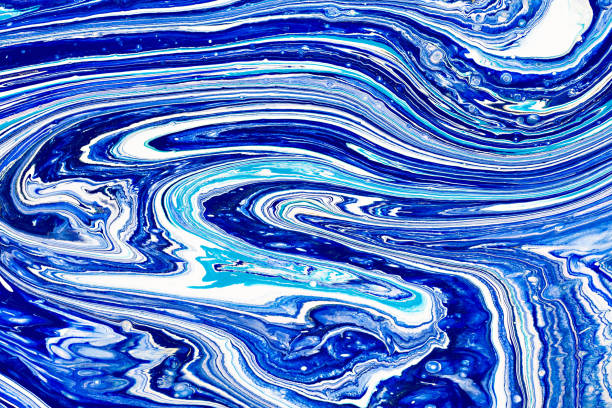 istock Hand painted background with mixed liquid blue, white, yellow paints. Abstract fluid acrylic painting. Applicable for packaging, invitation, textile, wallpaper, design of different surfaces 1130847478