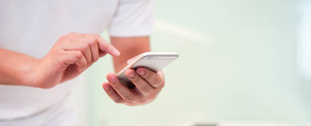 istock close up businessman holding smartphone for checking work or make appointment and using application for manage job or surf the internet at  office , technology lifestyle concept 1130850483