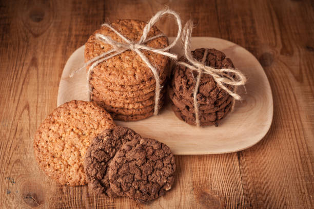 istock Various shortbread, oat cookies, chocolate chip biscuit on dark rustic wooden table. 1130851466