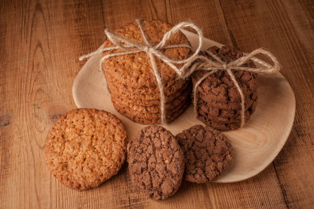 istock Various shortbread, oat cookies, chocolate chip biscuit on dark rustic wooden table. 1130851467