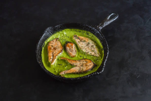 istock Green curry dish. Fish in spicy green curry. 1130851495