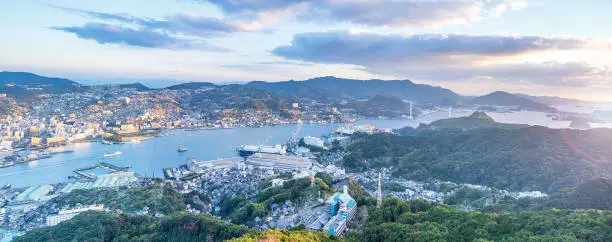 Business concept, modern cityscape of nagasaki dusk from mount inasa, the new top 3 nightview of the world, aerial view, copy space