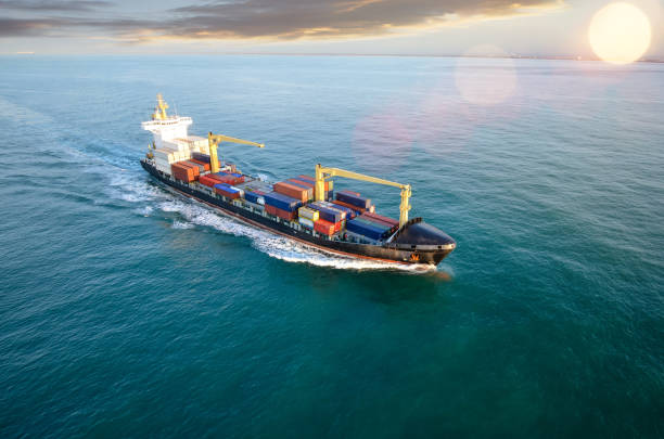 istock Aerial view of a cargo ship at dawn 1130855079
