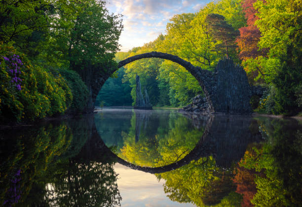 istock Rakotz Bridge (Rakotzbrucke, Devil's Bridge) in the spring scenery .Kromlau, Saxony, Germany. 1130855311
