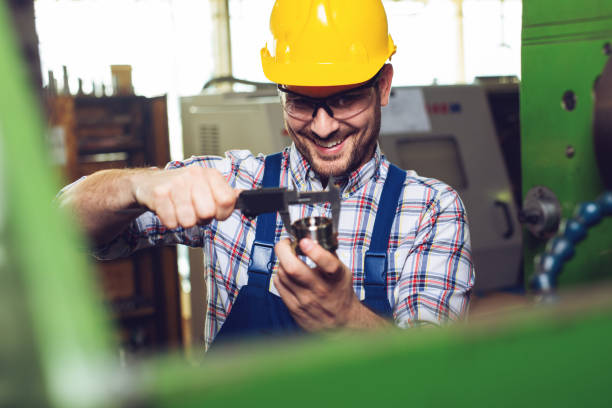 istock Industrial worker inspector measuring detail with Vernier Caliper 1130856744