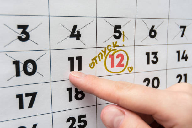 istock The hand points the finger on the calendar on the last working day before the release 1130857575