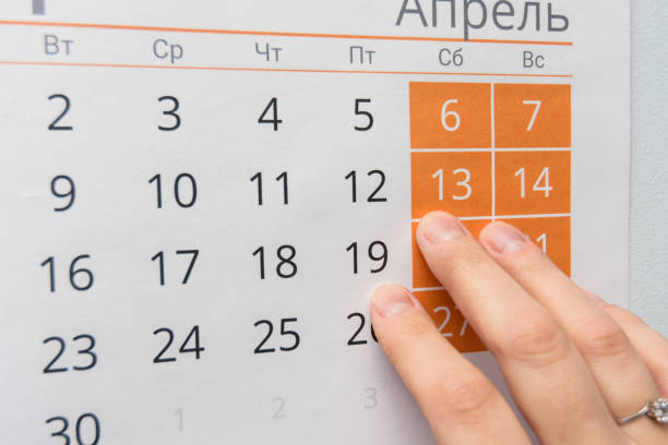 istock Fingers point to the weekend in the wall calendar 1130857576