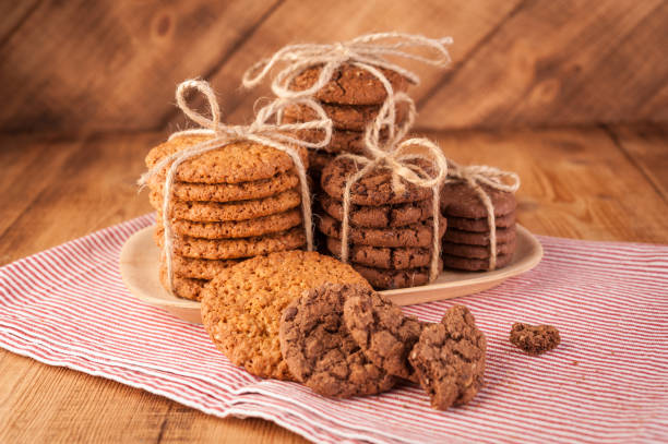 istock Various shortbread, oat cookies, chocolate chip biscuit on dark rustic wooden table. 1130857682