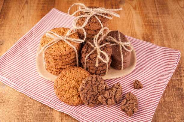 istock Various shortbread, oat cookies, chocolate chip biscuit on dark rustic wooden table. 1130857717