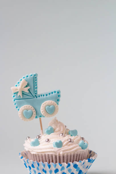 istock Baby shower cupcake for a boy. Newborn announcement concept. Text space 1130857746