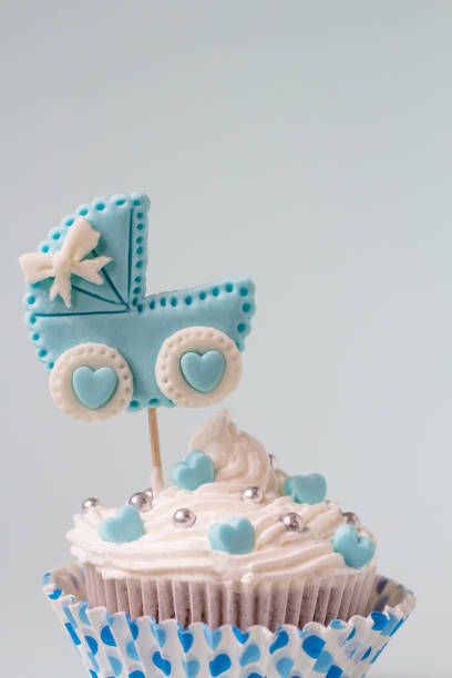 istock Baby shower cupcake for a boy. Newborn announcement concept. Text space 1130858962