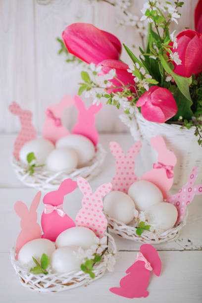 istock Happy easter. Decor of Easter eggs in the form of Easter bunnies in small white baskets. 1130861686