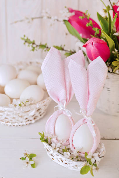 istock Happy easter. Decor of Easter eggs in the form of Easter bunnies in small white baskets. 1130861688