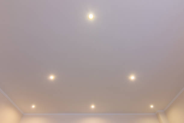 istock Ceiling in the room with spotlights installed and turned on 1130862407