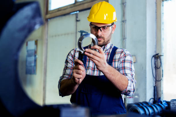 istock Industrial worker inspector measuring detail with Vernier Caliper 1130863070
