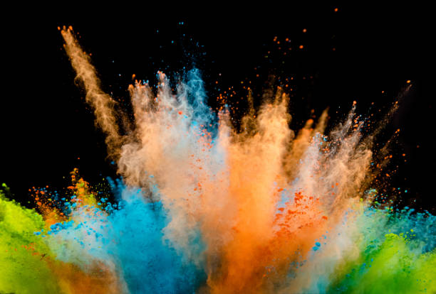 istock Explosion of colored powder on black background 1130864875