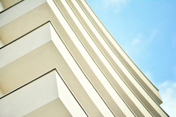 istock Modern white building with balcony on a blue sky 1130866925
