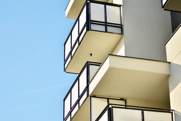 istock Modern white building with balcony on a blue sky 1130867075