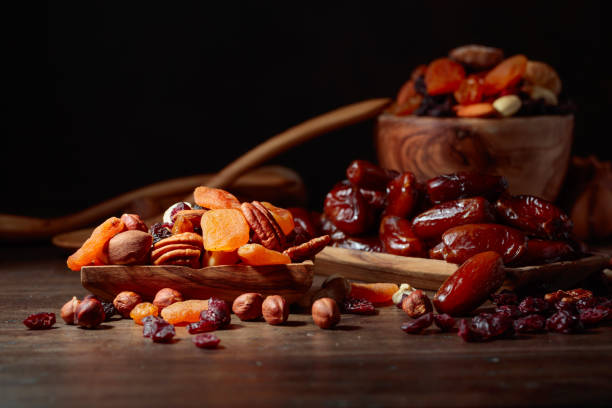istock Various dried fruits and nuts in wooden dish. 1130867249