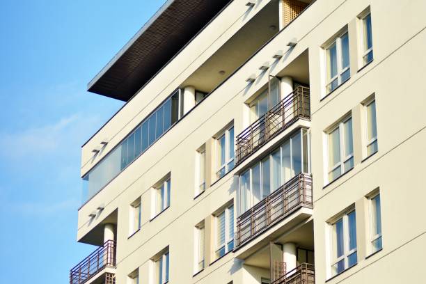 istock Modern white building with balcony on a blue sky 1130867475