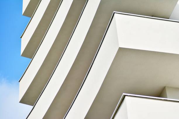 istock Modern white building with balcony on a blue sky 1130868194