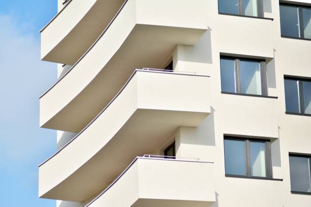 istock Modern white building with balcony on a blue sky 1130868238