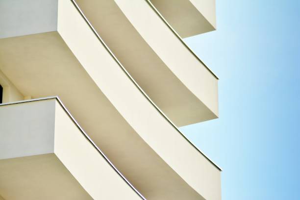 istock Modern white building with balcony on a blue sky 1130868283