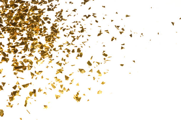 istock Background with gold glitter, pieces of foil on white background 1130868643