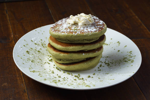 istock green tea pancakes with whipped butter on white plate 1130869765