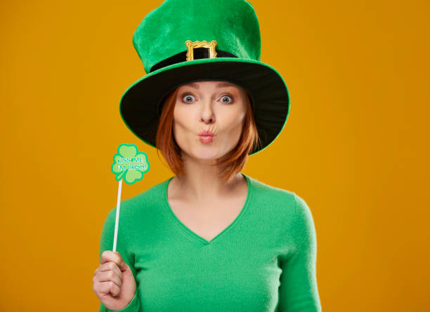 istock Happy leprechaun with green hat blowing a kiss 1130869975