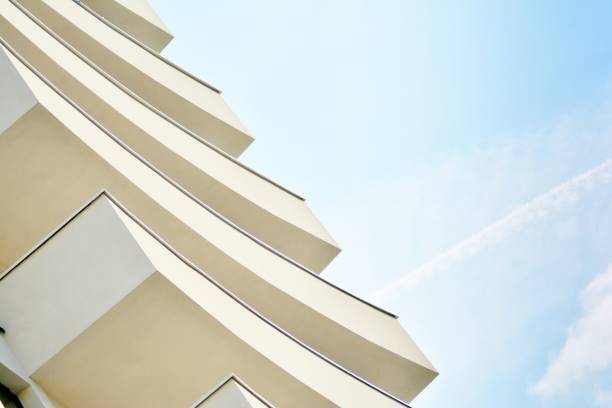 istock Modern white building with balcony on a blue sky 1130871086