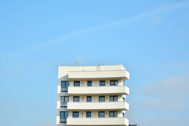 istock Modern white building with balcony on a blue sky 1130871130