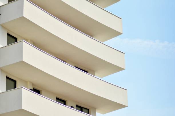 istock Modern white building with balcony on a blue sky 1130871205