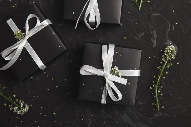 istock Gift boxes in Black and White color with flowers. Wrapping modern 1130872180