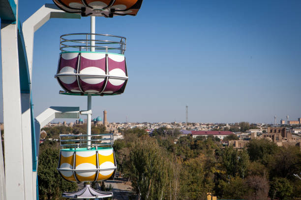 Old Observation ferris wheel at Bukhara City Park, Uzbekistan. View to the city and gondolas