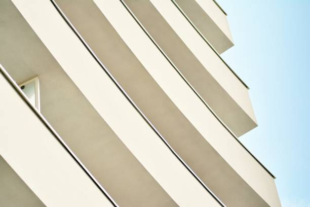 istock Modern white building with balcony on a blue sky 1130872545