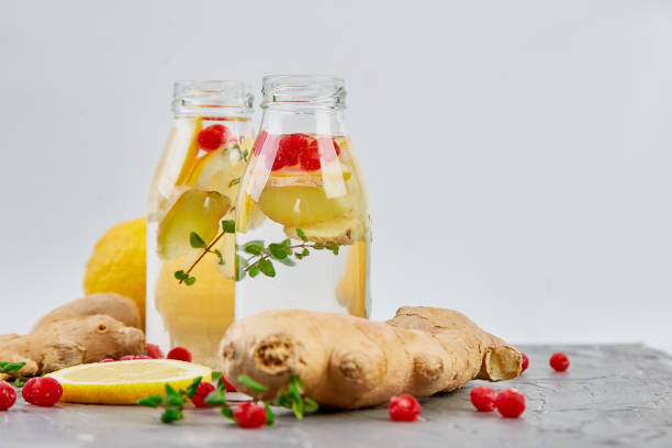 istock Detox water in bottles with cranberrie, ginger, lemon, mint 1130873824
