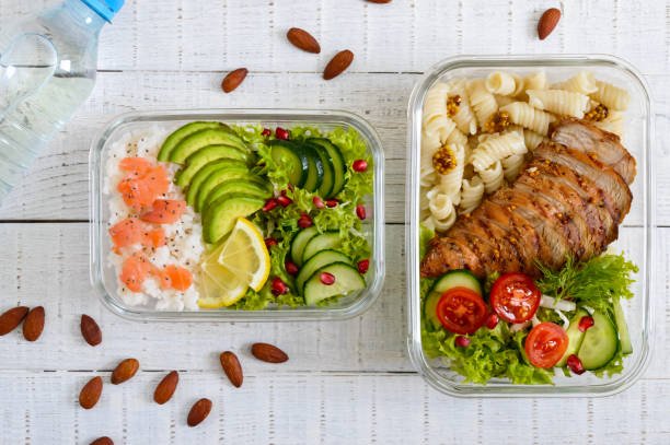 istock Different types of lunch boxes on a white wooden background. Top view, flat lay. Delicious healthy lunch. The concept of healthy eating. 1130876937