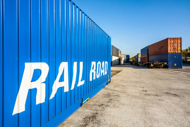 istock Cargo containers waiting on a railroad platform in a river port. 1130877028