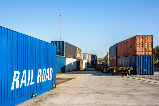 istock Cargo containers waiting on a railroad platform in a river port. 1130878241