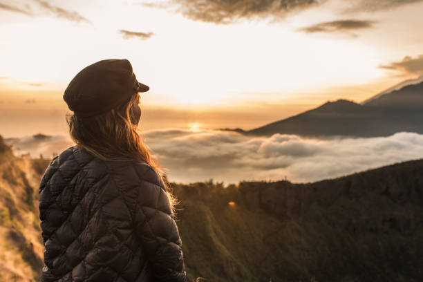 istock Lady enjoying in amazing sunset 1130880842
