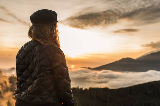 istock Lady enjoying in amazing sunset on mountain 1130880877