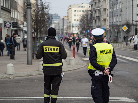 Gdynia / Pomerania-Poland 17 February 2019. Policeman and Firefighter securing Gdynia's Birthday Run at a distance of 10 km.