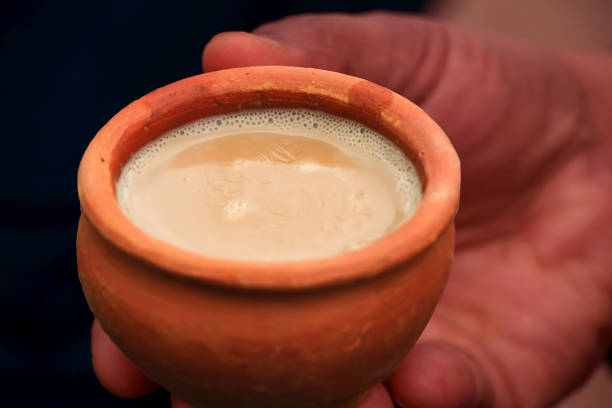 istock Clay tea cup being hold in the hand 1130882184