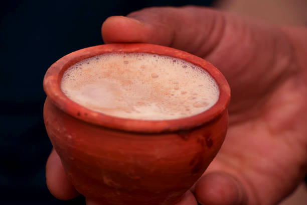 istock Clay tea cup being hold in the hand 1130882198