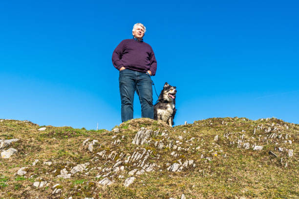 istock Senior Caucasian man with dog 1130883233