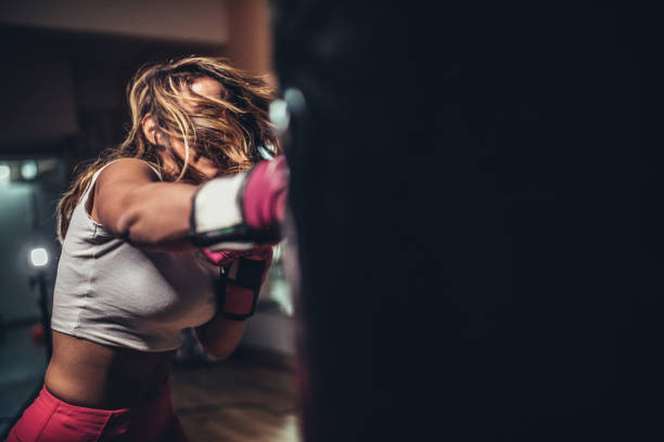 istock Tough woman boxer training 1130883750